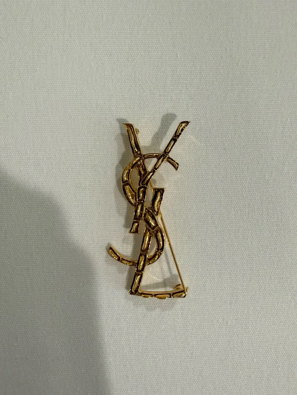 Saint Laurent Goldtone Textured Logo Brooch